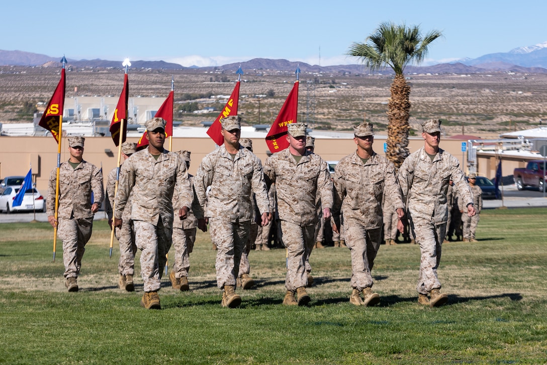 U.S. Marines assigned to 3rd Battalion, 7th Marine Regiment, march in formation during a 3rd battalion, 7th Marine Regiment change of command ceremony at Marine Corps Air Ground Combat Center, Twentynine Palms, California, May 5, 2023. The ceremony represented a transfer of responsibility, authority, and accountability from Lt. Col. Tyler Holt to Lt. Col. Matthew Hawkins. (U.S. Marine Corps photo by Cpl. Breanna Eason)