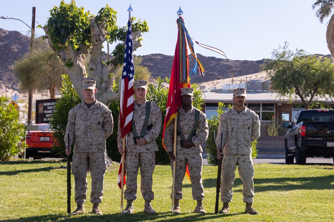 U.S. Marines with 3rd Battalion, 7th Marine Regiment, color guard prepare to present colors during a 3rd battalion, 7th Marine Regiment change of command ceremony at Marine Corps Air Ground Combat Center, Twentynine Palms, California, May 5, 2023. The ceremony represented a transfer of responsibility, authority, and accountability from Lt. Col. Tyler Holt to Lt. Col. Matthew Hawkins. (U.S. Marine Corps photo by Cpl. Breanna Eason)