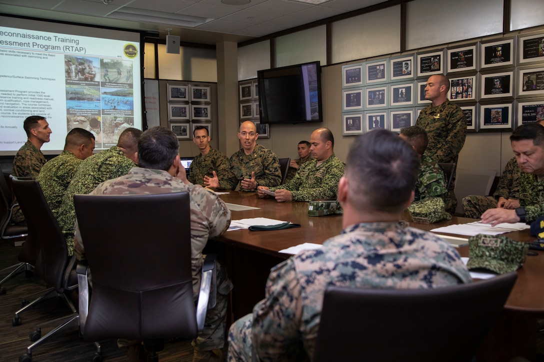 U.S. Marine Corps Maj. Jordan Morgan, company commander at Infantry Training Battalion School of Infantry - West briefs Colombian military leadership about expeditionary operations training group during a visit to Marine Corps Base Camp Pendleton, California, Feb. 15, 2023. The visit is designed to reinforce strategic relationships between senior Colombian military and senior Marine Corps leadership. During the visit, Marine Corps leaders briefed senior Colombian leadership about tactical concepts and general strategy. (U.S. Marine Corps photo by Sgt. Nello Miele)