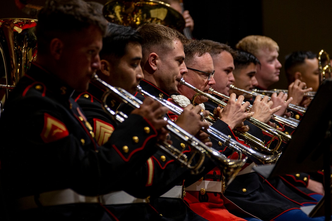 Marines in uniform playing trumpets