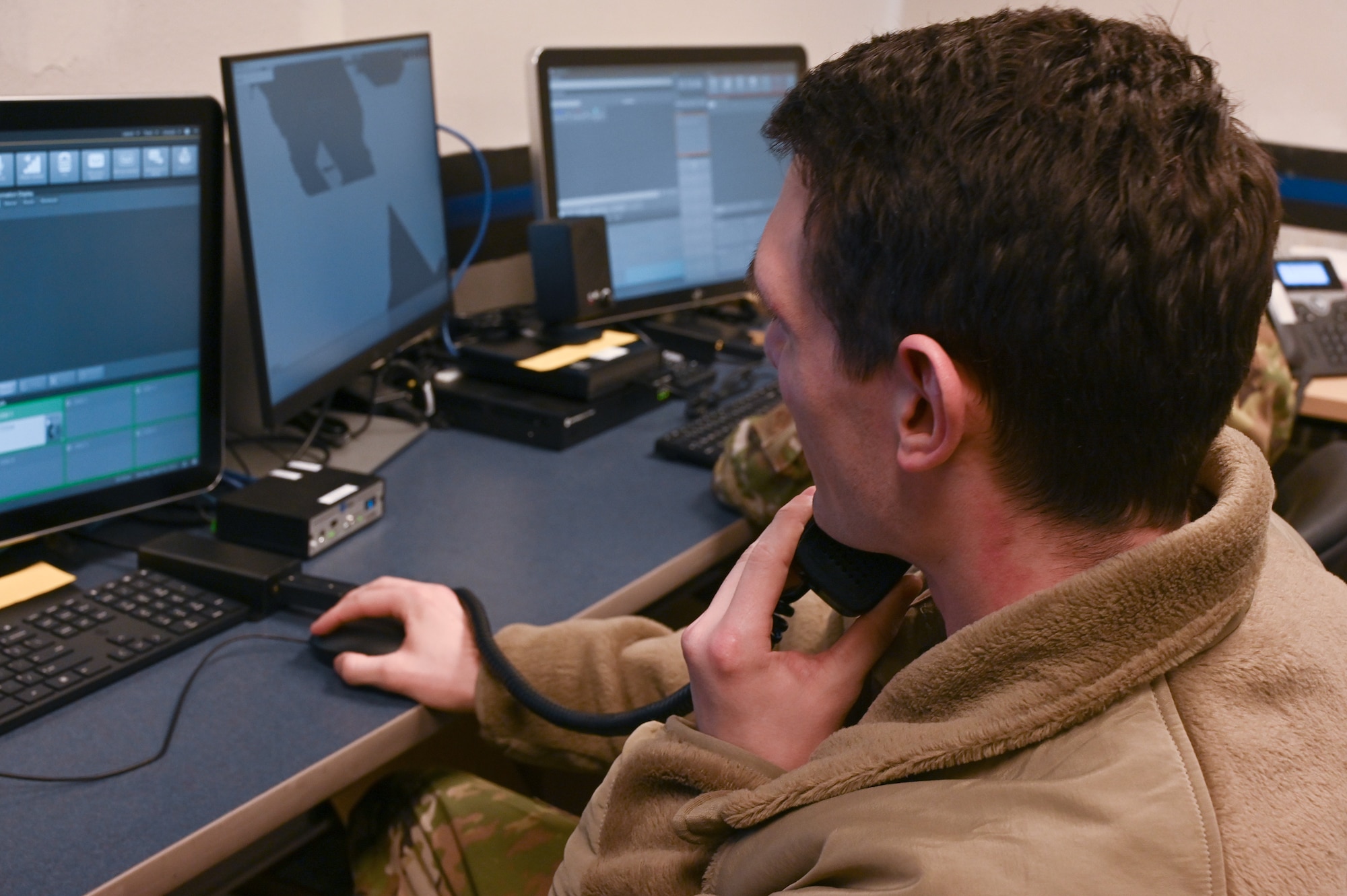 U.S. Air Force Senior Airman Troy Traeger, 354th Civil Engineering Squadron fire dispatcher, takes a practice phone call during the updated 911 system training April 27, 2023 at Eielson Air Force Base. Eielson Air Force Base recently changed to the Vesta E-911 system that provides a more streamlined and updated system for emergency dispatchers. (U.S. Air Force photo by Staff Sgt. Danielle Sukhlall)