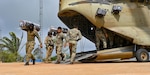 Members of Panama’s Servicio Nacional de Fronteras (SENAFRONT) transfer cargo from a CH-47 Chinook assigned to the 1st Battalion, 228th Aviation Regiment as part of exercise Keel Billed Toucan 2023 (known locally as Mercurio V) at a remote location in Panama, May 7, 2023. Since the 1980s, exercises like KBT 23 give Joint Task Force-Bravo, based in Honduras, opportunities to hone its humanitarian assistance and disaster relief skills by working with regional partners, while also providing aid to remote areas across Central America. (U.S. Air Force photo by Tech. Sgt. Duncan McElroy)