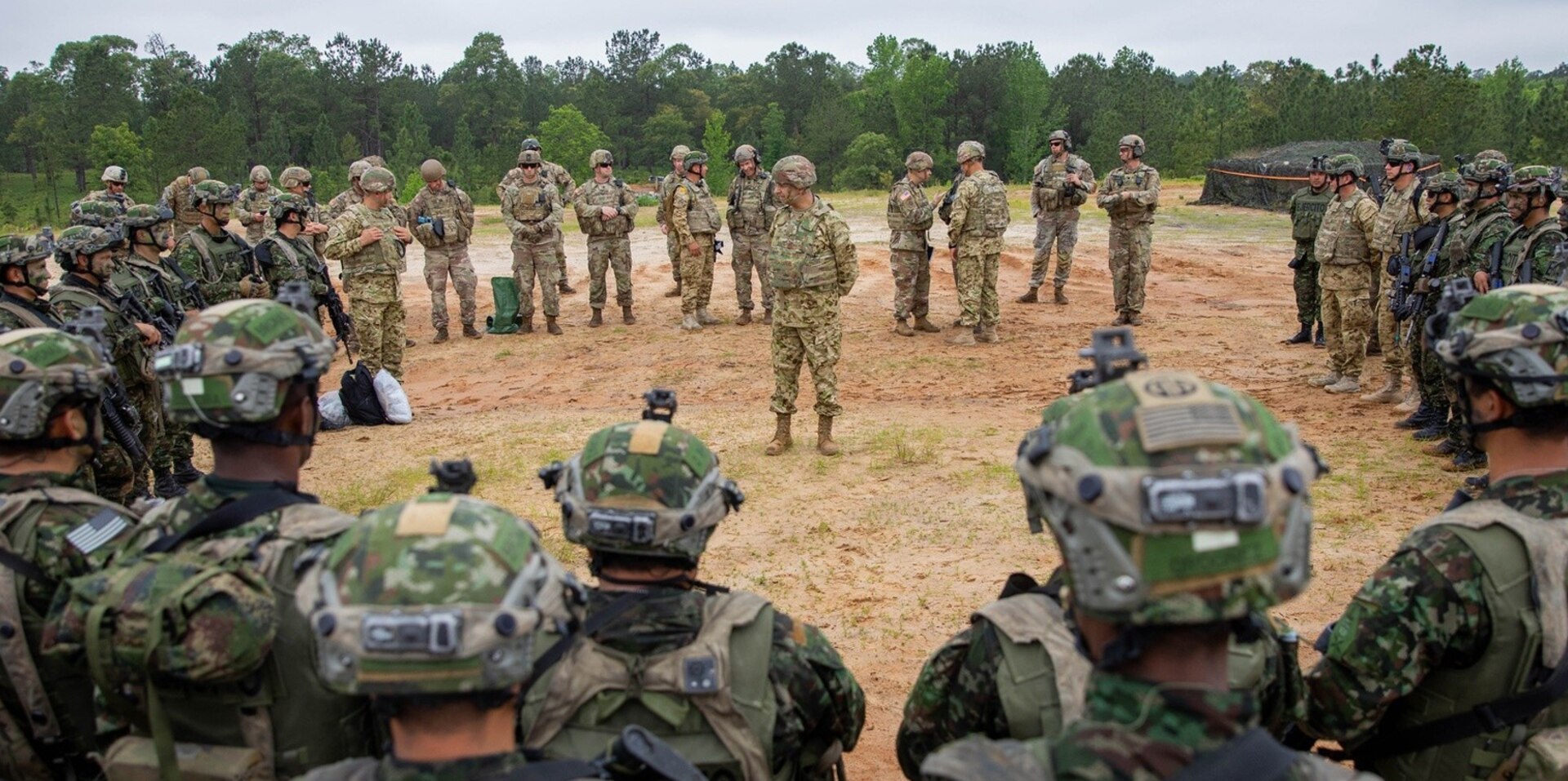Colombian Army Maj. Gen. Alvaro Vicente Perez Duran, Deputy Commander of the Colombian Army, adresses a group of Colombian and U.S. Soldiers after they completed their live fire training lane during their Joint Readiness Training Center rotation at Fort Polk, La. on May 5, 2023.