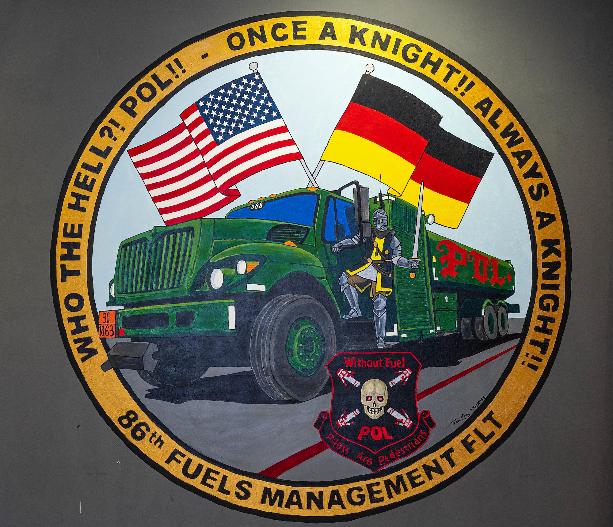 U.S. Air Force Airman Lyndsey Cordova, 86th Logistics Readiness Squadron fuels technician, highlights the fuels management flight with a mural she painted on the flight operations office wall at Ramstein Air Base, Germany, May 11, 2023. Last year the flight won an award for best fuels management flight within the U.S. Air Forces in Europe. (U.S. Air Force photo by Senior Airman Isaac Olivera)