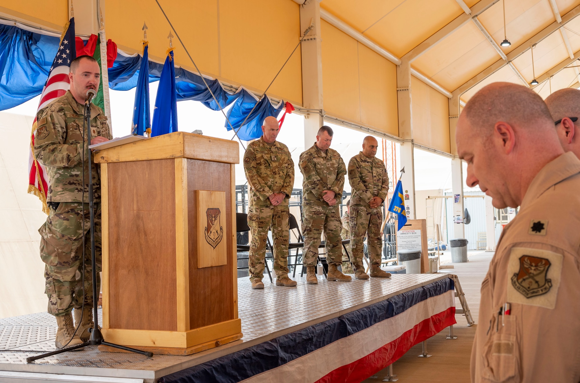 U.S. Air Force Chaplain (Maj.) Joel Heath, 378th Air Expeditionary Wing Chaplain, delivers an invocation during a change of command ceremony at Prince Sultan Air Base, Kingdom of Saudi Arabia, May 18, 2023. During the ceremony, Brig. Gen. William Betts relinquished command of the 378th AEW to Brig. Gen. Akshai Gandhi. The tradition of change of command ceremonies are to allow service members to witness their new leader assume the responsibility and trust associated with the position of commander. (U.S. Air Force photo by Senior Airman Stephani Barge)