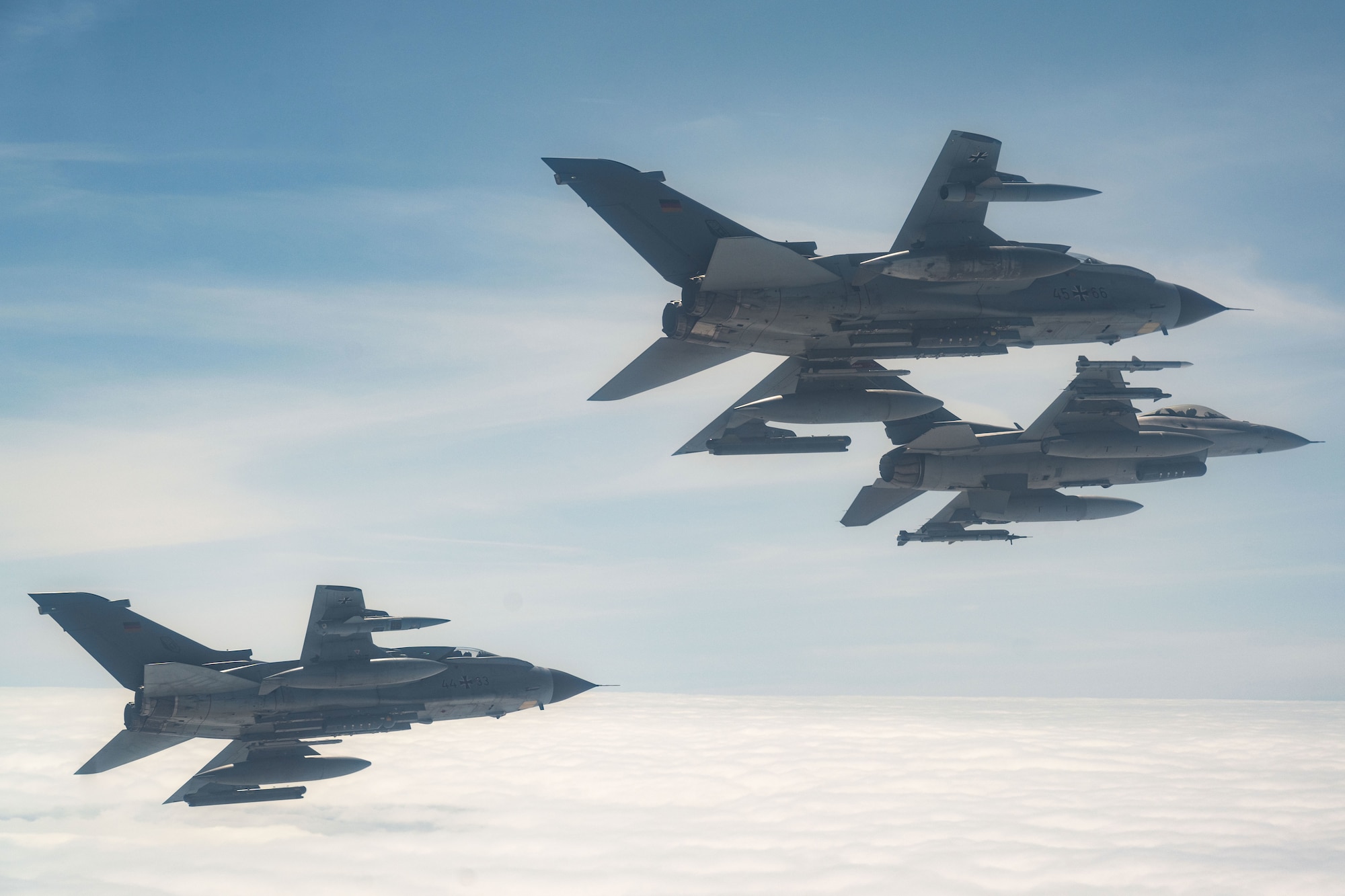 A U.S. Air Force F-16 Fighting Falcon assigned to the 480th Fighter Squadron at Spangdahlem Air Base, Germany, flies alongside two German Air Force PA-200 Tornado aircraft assigned to Tactical Air Wing 33, Büchel AB