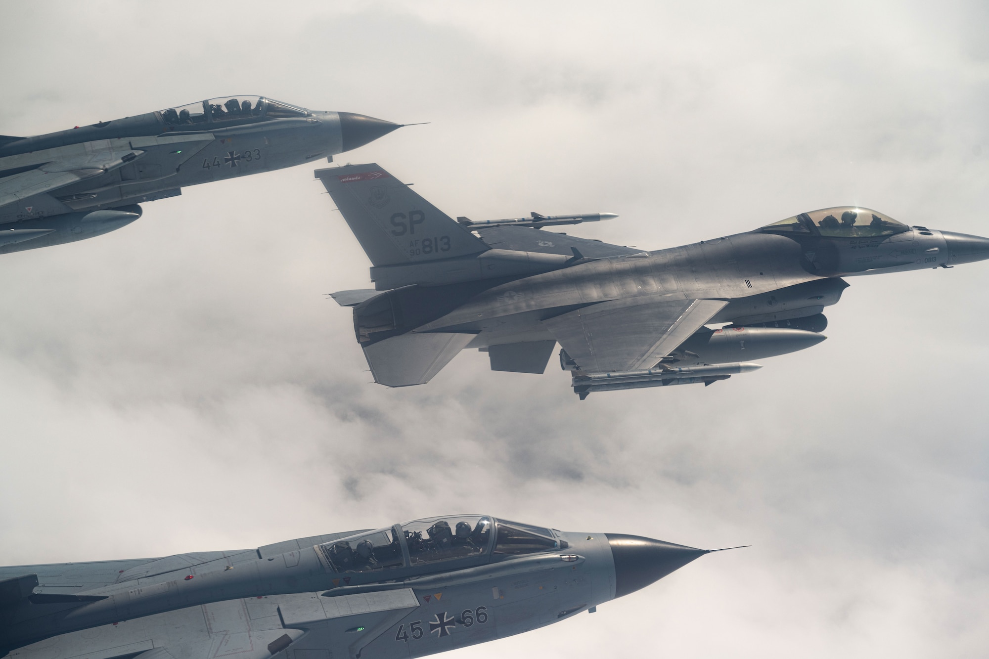 A U.S. Air Force F-16 Fighting Falcon assigned to the 480th Fighter Squadron at Spangdahlem Air Base, Germany, flies alongside two German Air Force PA-200 Tornado aircraft assigned to Tactical Air Wing 33, Büchel AB