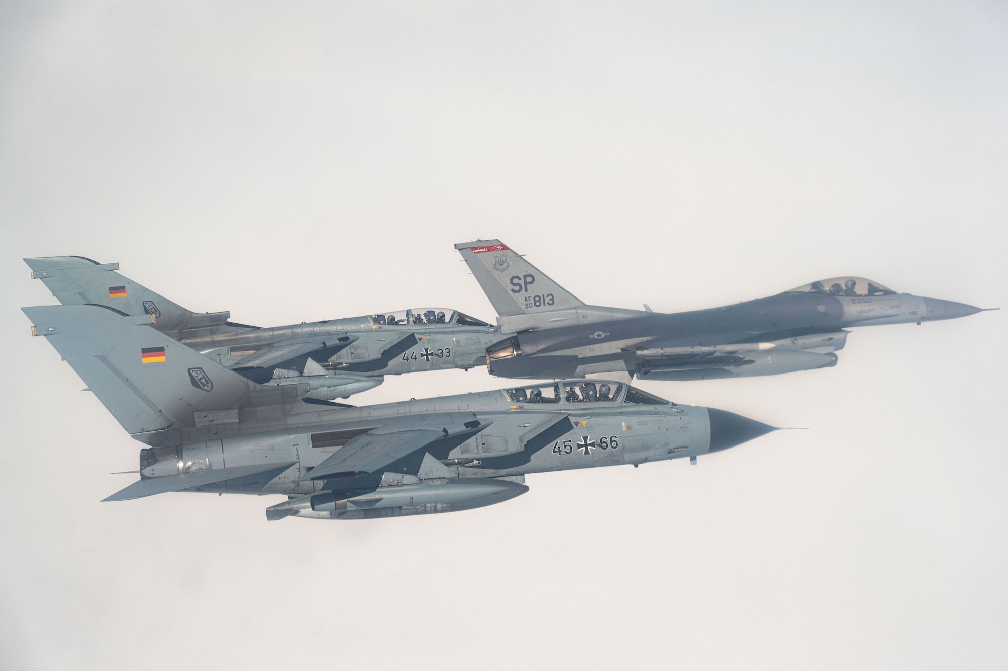 A U.S. Air Force F-16 Fighting Falcon assigned to the 480th Fighter Squadron at Spangdahlem Air Base, Germany, flies alongside two German Air Force PA-200 Tornado aircraft assigned to Tactical Air Wing 33, Büchel AB