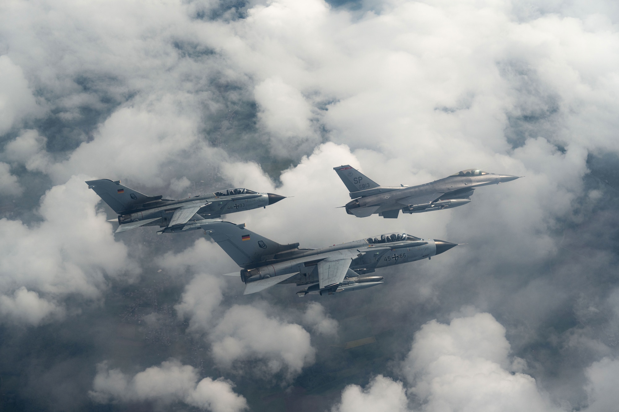 A U.S. Air Force F-16 Fighting Falcon assigned to the 480th Fighter Squadron at Spangdahlem Air Base, Germany, flies alongside two German Air Force PA-200 Tornado aircraft assigned to Tactical Air Wing 33, Büchel AB, Germany