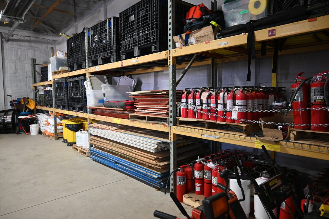 Photo of equipment organized on shelves in a storage room.