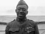 Sgt. Henry Johnson wears his French Croix de Guerre as the 369th Infantry Regiment, formerly the 15th Infantry (Colored), New York National Guard, arrives back in New York City in 1919 after fighting in France in World War I.  Johnson was the first American Soldier to be awarded the French medal.