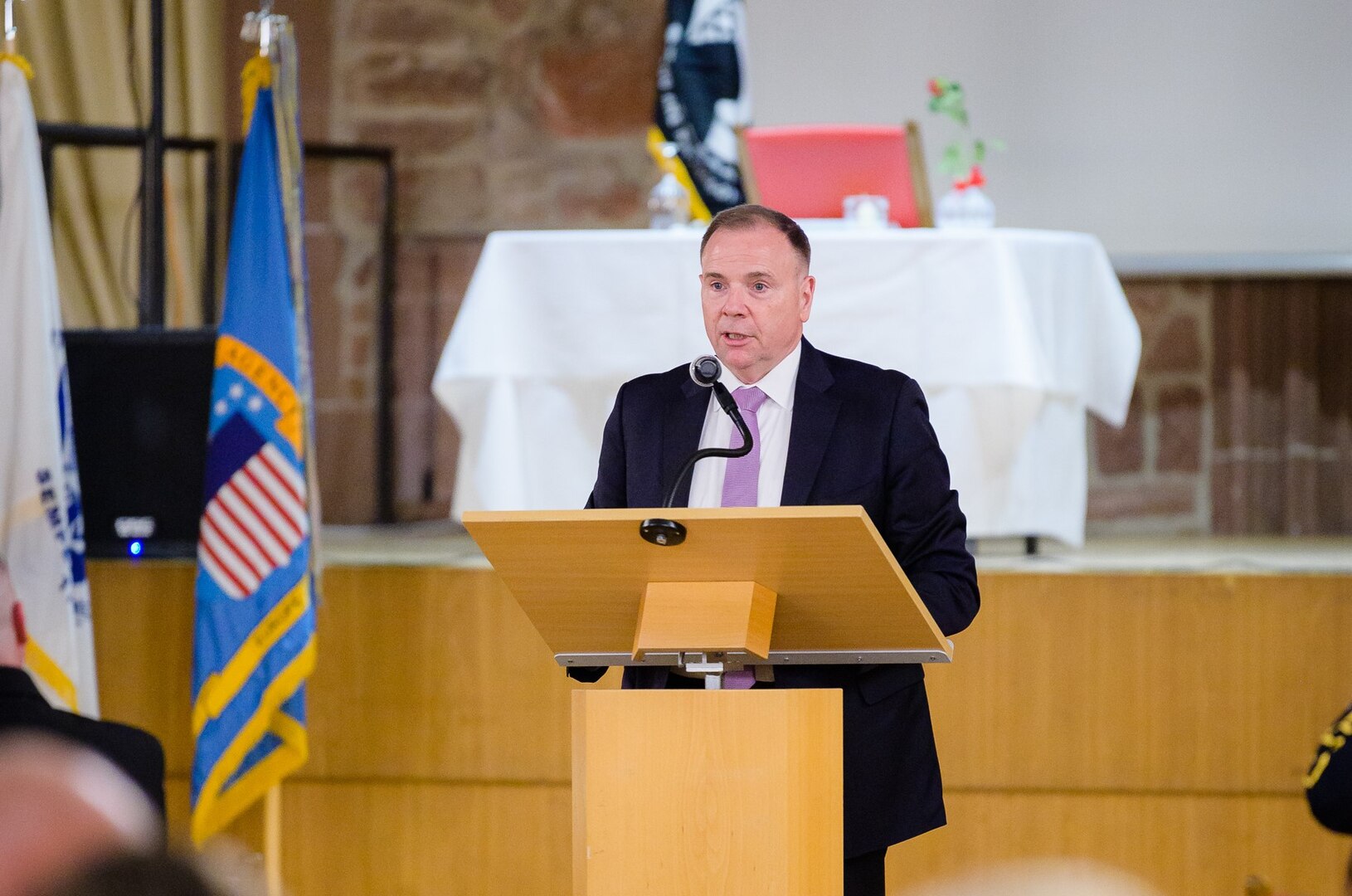 Retired Army Lt. Gen. Ben Hodges speaks behind a lectern.