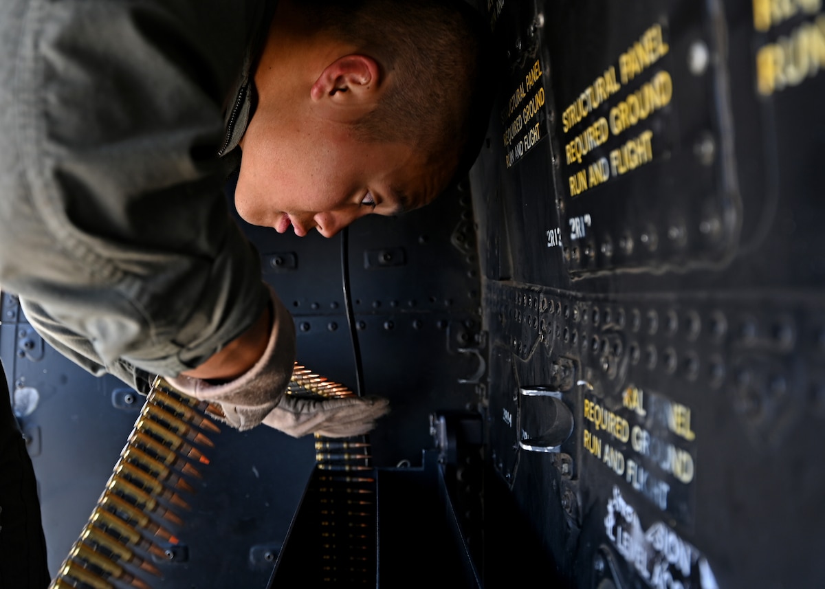 U.S. Marine Corps Lance Cpl. Rei Kitamura, Marine Light Attack Helicopter Squadron 775 crew chief, counts ammunition during Exercise RED FLAG-Rescue 23-1 at the Barry M. Goldwater Range, Gila Bend, Ariz., May 13, 2023. Joint service members and multinational partners attended the training exercise to synergize war fighting capabilities, develop professional and technical expertise, and build integrated leadership for the future fight. (U.S. Air Force photo by Staff Sgt. Abbey Rieves)