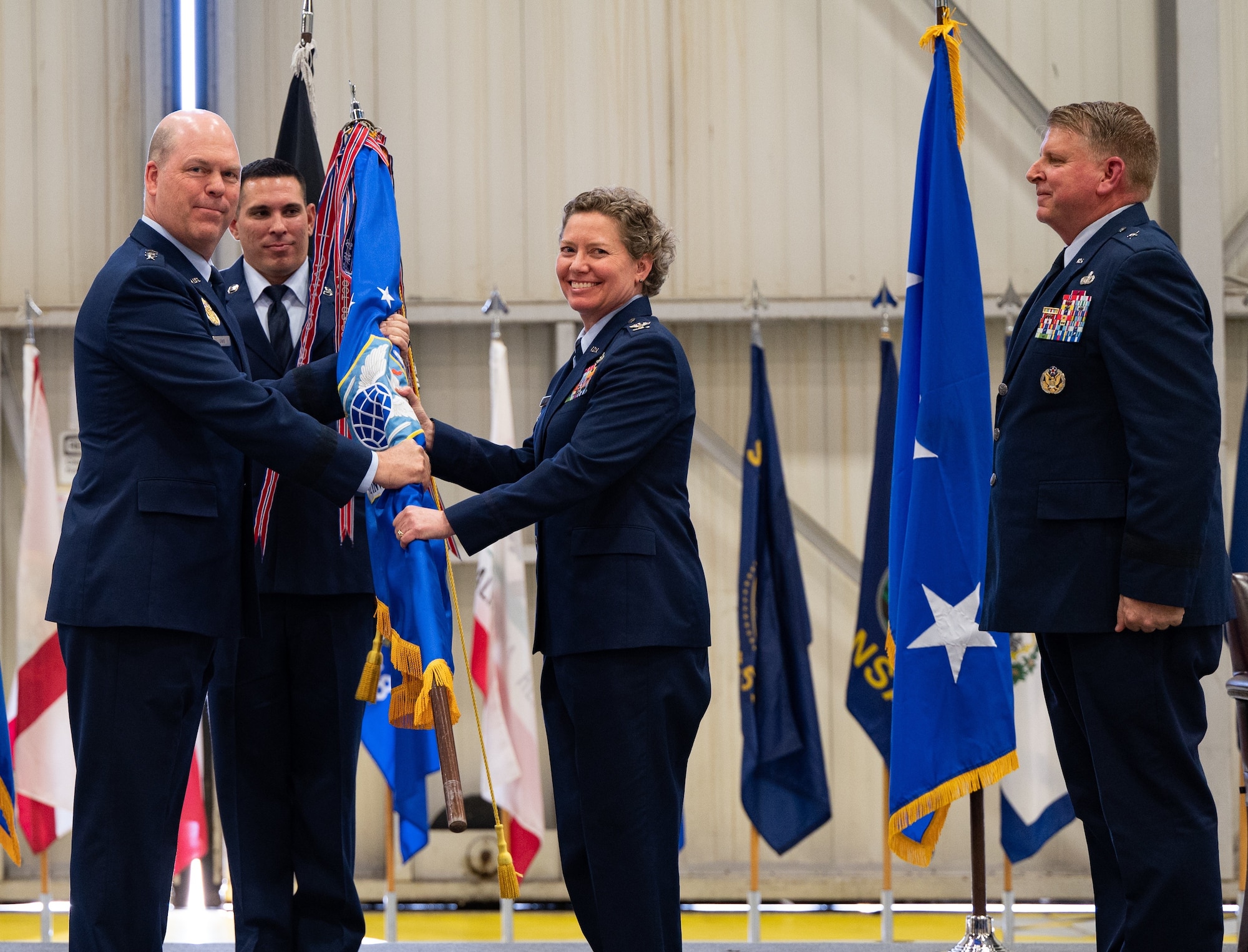 Col. Amy Bumgarner assumes command as the 20th Office of Special Investigations commander during the change of command ceremony on May 16, 2023, at Joint Base Andrews, Maryland, presided over by Lt. Gen. Stephen L. Davis, left, the Inspector General of the Department of the Air Force. Bumgarner succeeded Brig. Gen. Terry Bullard, right, as OSI commander. (U.S. Air Force Photo by Thomas Brading, OSI/PA)