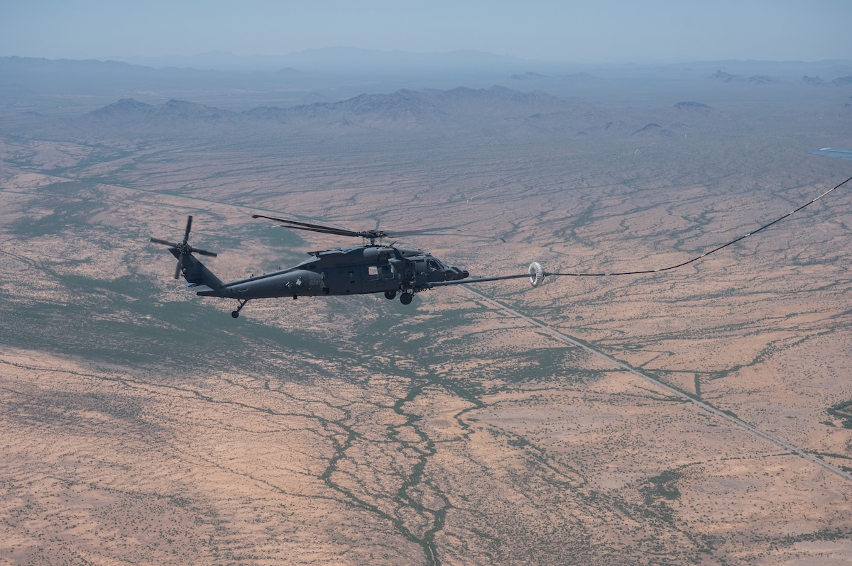 A U.S. Air Force HH-60W Jolly Green II helicopter, assigned to Kirtland Air Force Base, New Mexico, refuels over Arizona, May 13, 2023. The HH-60W was en route to locate and rescue a simulated downed-pilot during RED FLAG-Rescue 23-1, the Department of Defense’s premier combat search and rescue exercise. (U.S. Air Force photo by Airman 1st Class Jasmyne Bridgers-Matos)