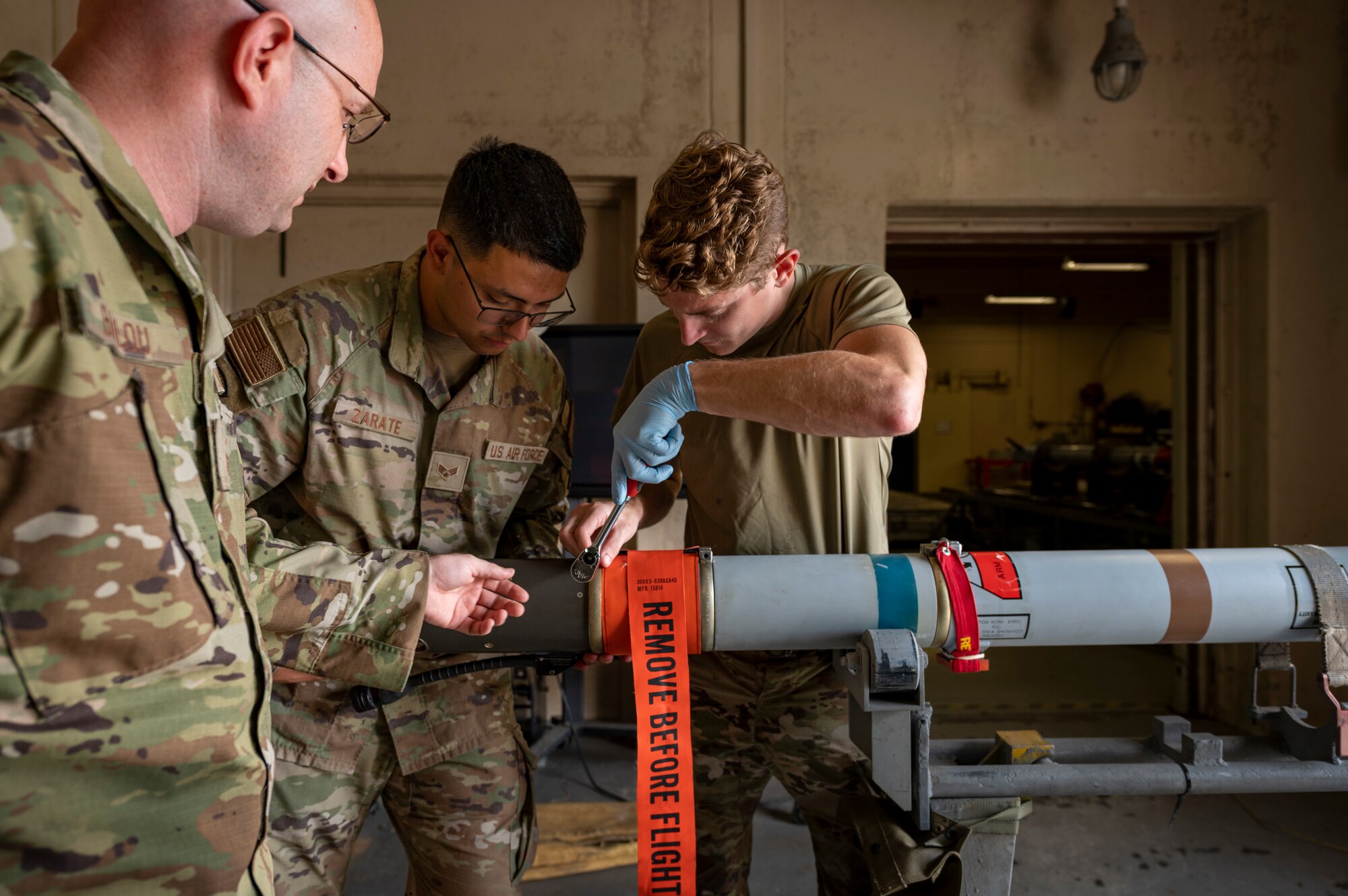 Men working on a missile