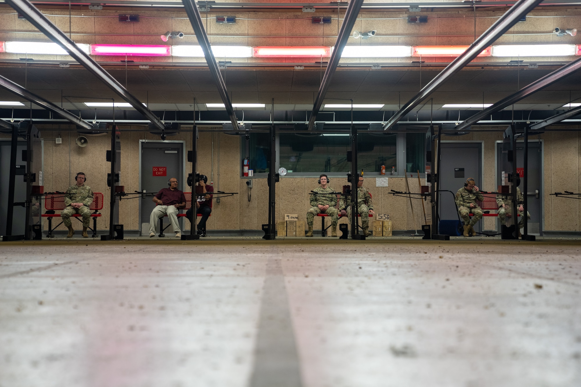 Airmen and civilians wait for the next course of fire as their targets are scored during the National Police Week Pistol Competition at Keesler Air Force Base, Mississippi, May 17, 2023.