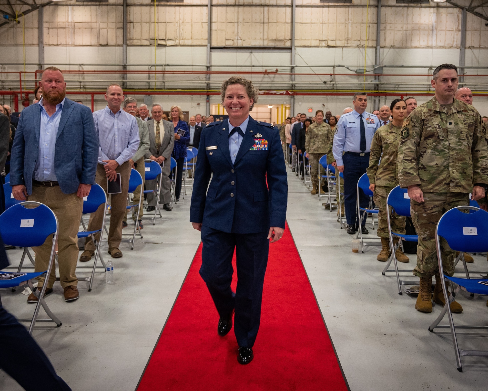 Col. Amy Bumgarner approaches the stage where she assumed command as the 20th Office of Special Investigations commander during the change of command ceremony on May 16, 2023, at Joint Base Andrews, Maryland. Bumgarner became the first female commander of OSI in its 75 year history. (U.S. Air Force Photo by Thomas Brading, OSI/PA)