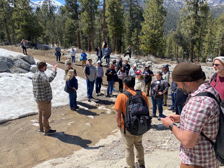 Las Vegas, NV -- Dr. Ian Floyd, U.S. Army Corps of Engineers, Engineer Research and Development Center, describes the characteristics and effects of the 2013 Carpenter One fire in the Spring Mountains, Nevada on the landscape, flooding, and sediment at the first USACE Certified Wildfire Mitigation Specialist Wildfire Workshop held April 24-27, 2023. The setting is within the Rainbow Canyon berm and diversion channel designed by USACE Los Angeles District in cooperation with the United States Forest Service to protect nearby residents from repeated debris flows immediately following the fire.