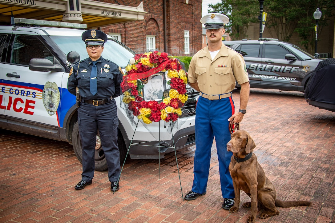 LAW ENFORCEMENT MEMORIAL: Members of the law enforcement community remembered their fallen comrades during a ceremony at Albany Municipal Auditorium, May 18.

Representatives of multiple law enforcement agencies, including the Marine Corps Police Department at Marine Corps Logistics Base Albany, pinned flowers on the wreaths and retired Marine Col. Dan Gillan played a bagpipe rendition of Amazing Grace.

The ceremony also included a final radio call and joint proclamation by Albany Albany 911 Communications.

Among those honored was Marine Cpl. Dustin Jerome Lee. Lee, a K-9 handler, was killed in Iraq on March 21, 2007. The kennel at MCLB Albany is named after him. 

(Photos by Jonathan Wright)