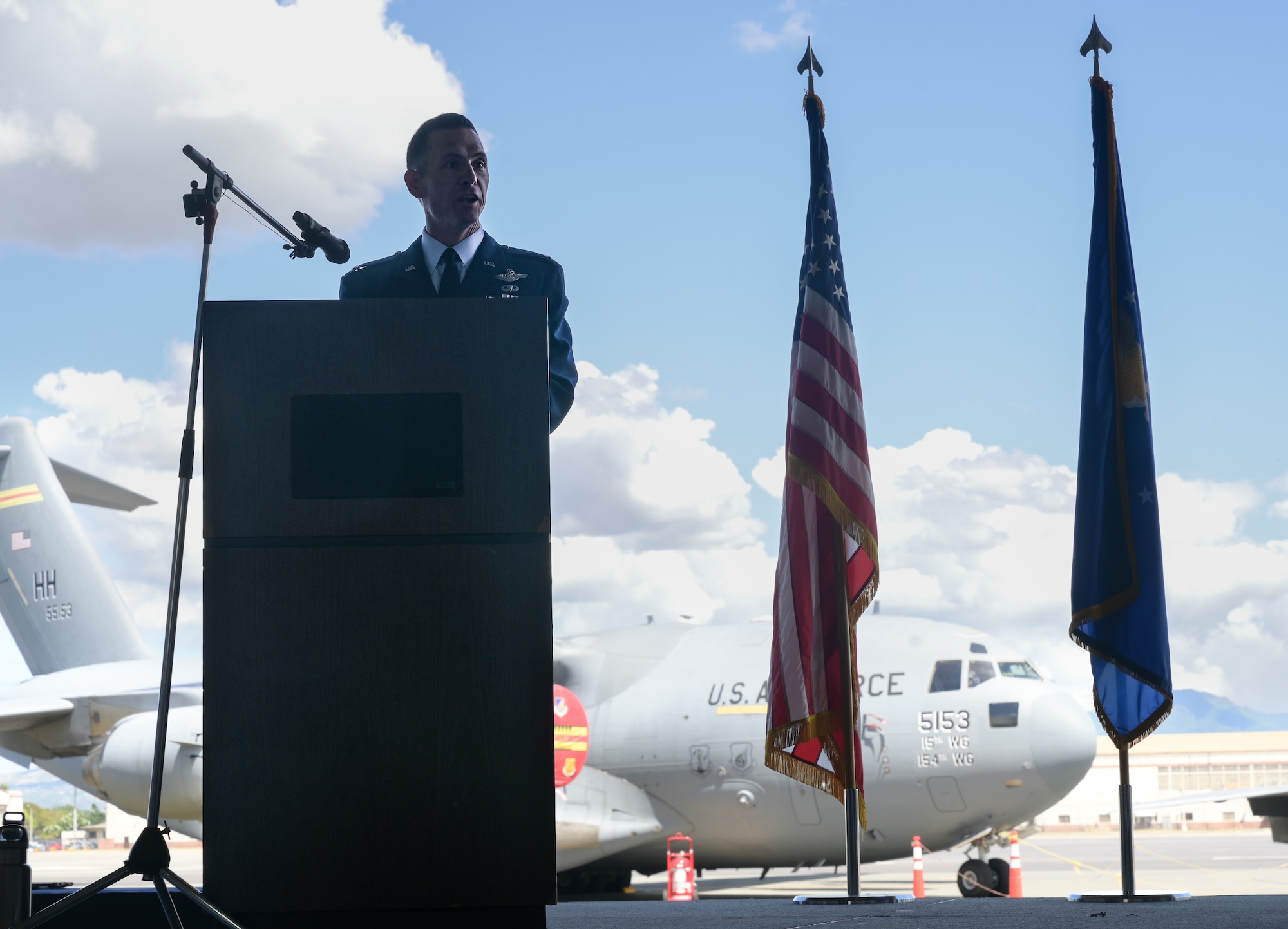 Col. Michael Lewis, 15th Operations Group commander, speaks after assuming command during a change of command ceremony on Joint Base Pearl Harbor-Hickam, Hawaii, May 12, 2023. Lewis assumed command of the 15th OG after serving as the commander and strategy division chief of the 613th Air Operations Center, leading a team of 40 strategic planners responsible for long-range planning of Air Space, Cyber and Information Operations. (U.S. Air Force photo by Staff Sgt. Alan Ricker)