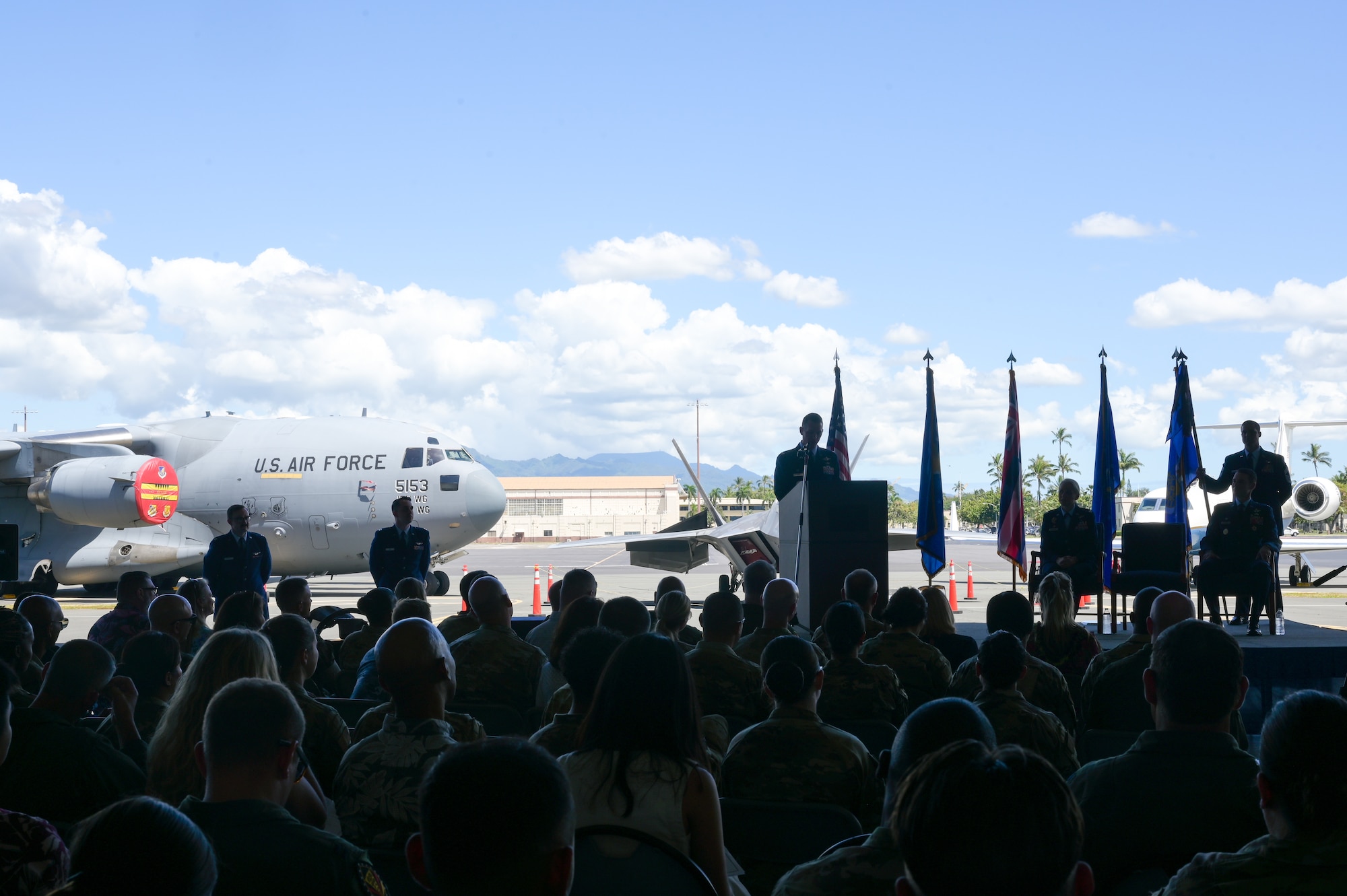 Col. Michael Lewis, 15th Operations Group commander, speaks after assuming command during a change of command ceremony on Joint Base Pearl Harbor-Hickam, Hawaii, May 12, 2023. Lewis assumed command of the 15th OG after serving as the commander and strategy division chief of the 613th Air Operations Center, leading a team of 40 strategic planners responsible for long-range planning of Air Space, Cyber and Information Operations. (U.S. Air Force photo by Staff Sgt. Alan Ricker)