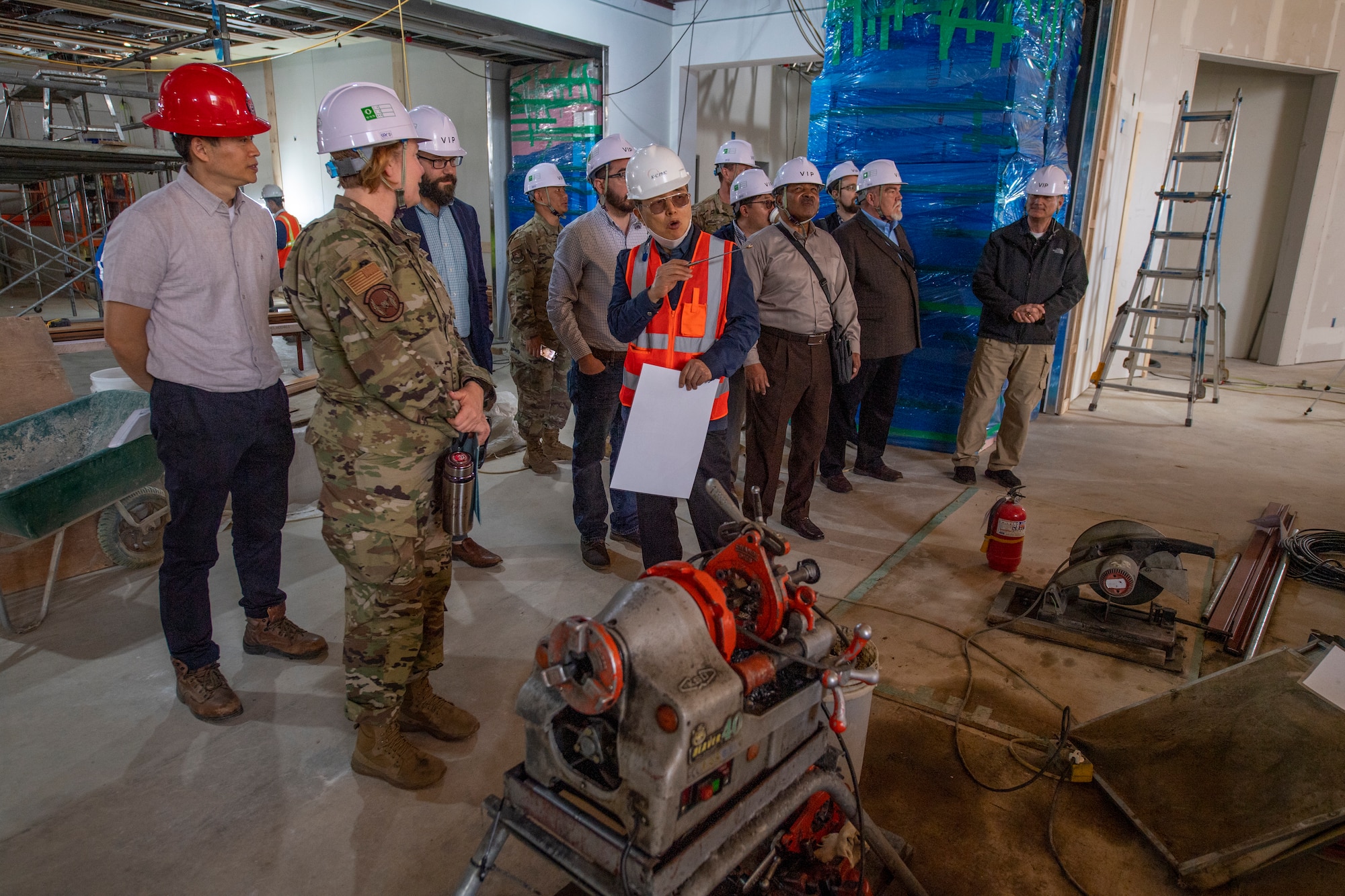 In Chul Park, chapel construction manager supervisor, gives a tour of the 51st Fighter Wing chapel construction site to local clergy and 51FW chapel personnel on Osan Air Base, Republic of Korea, May 4, 2023.  One focus of the tour was to familiarize local religious leaders with services provided on base including worship services, counseling, unit engagement, and leadership engagement. (U.S. Air Force Photo by Airman 1st Class Aaron Edwards)