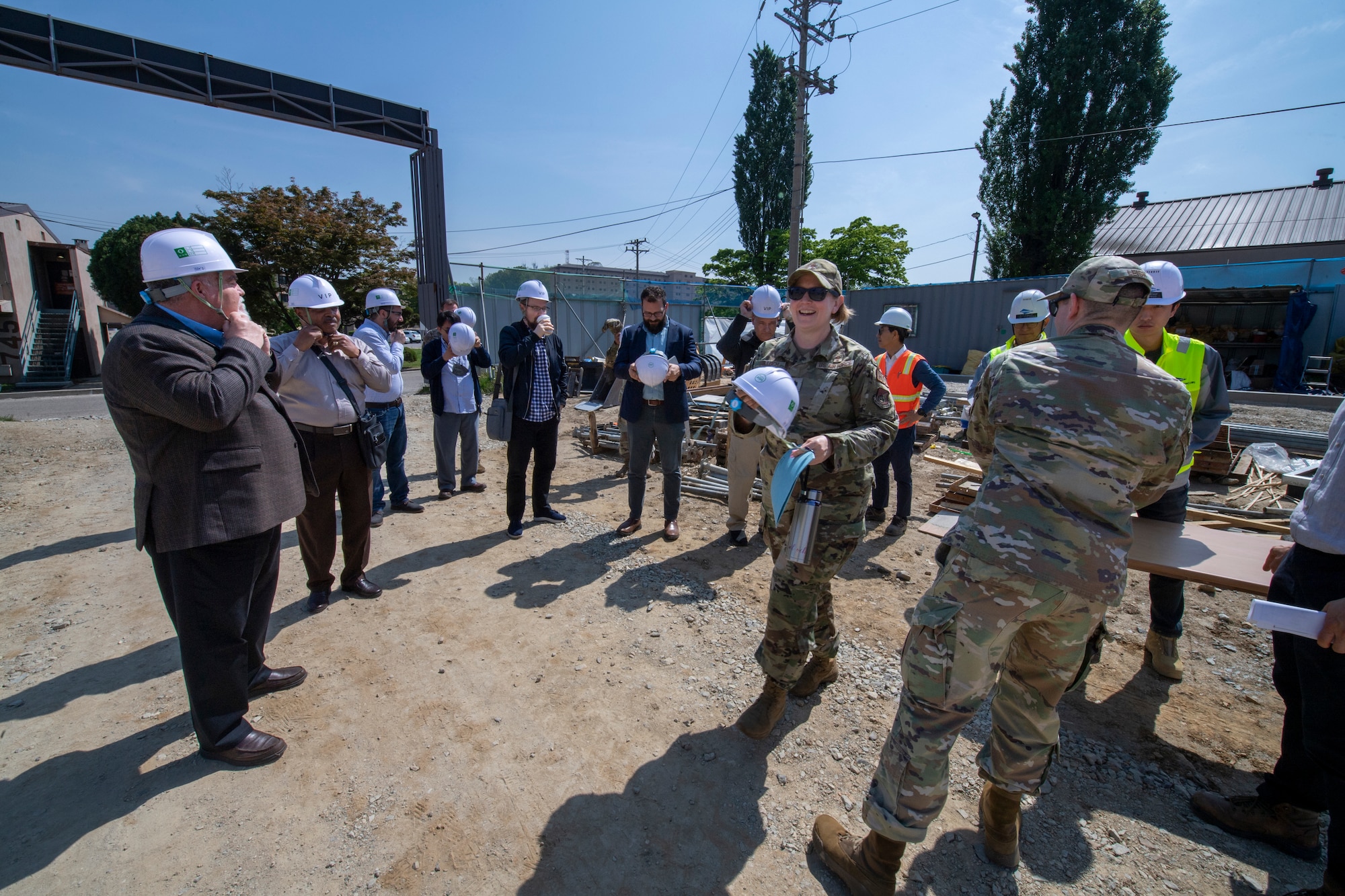 A group of local clergy and 51st Fighter Wing chapel personnel dawn personal protective equipment before touring the 51FW chapel construction site on Osan Air Base, Republic of Korea, May 4, 2023.  During the clergy tour, members were able to familiarize themselves with what military life entails and were given the 51st FW mission brief to better understand the jobs and day-to-day lives of the people they serve. (U.S. Air Force Photo by Airman 1st Class Aaron Edwards)