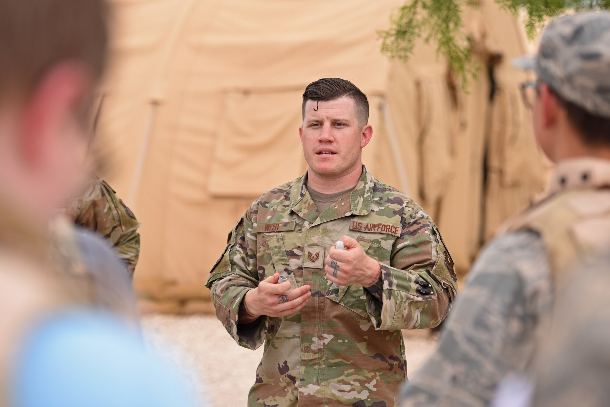 U.S. Air Force Tech. Sgt. Cody West, 17th Civil Engineer Squadron emergency management noncommissioned officer in charge, speaks to Junior Reserve Officers’ Training Corps students during Operation Next Generation at Goodfellow Air Force Base, Texas, May 12, 2023. The students learned about self aid buddy care and hazardous materials as part of the exercise. (U.S. Air Force photo by Senior Airman Ashley Thrash)