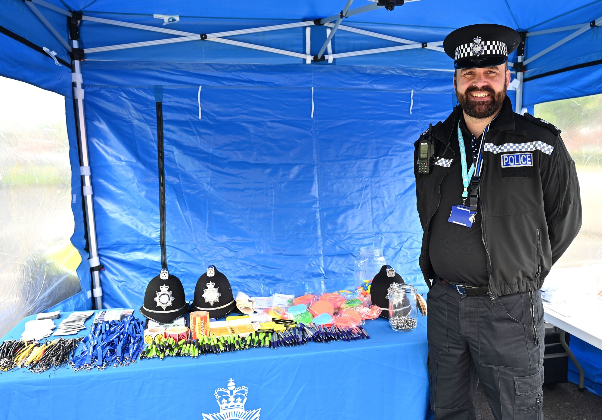 Police Constable Richard Smith, Suffolk Constabulary and Mildenhall, Newmarket and Brandon engagement officer, participates in the Police Week show-and-tell event at Royal Air Force Mildenhall, England, May 19, 2023. Police Week is held every year in May and this year is May 15 to 19. This year’s events include a ruck march, Defenders’ Challenge, “jail and bail,” and Fallen Defender memorial. (U.S. Air Force photo by Karen Abeyasekere)