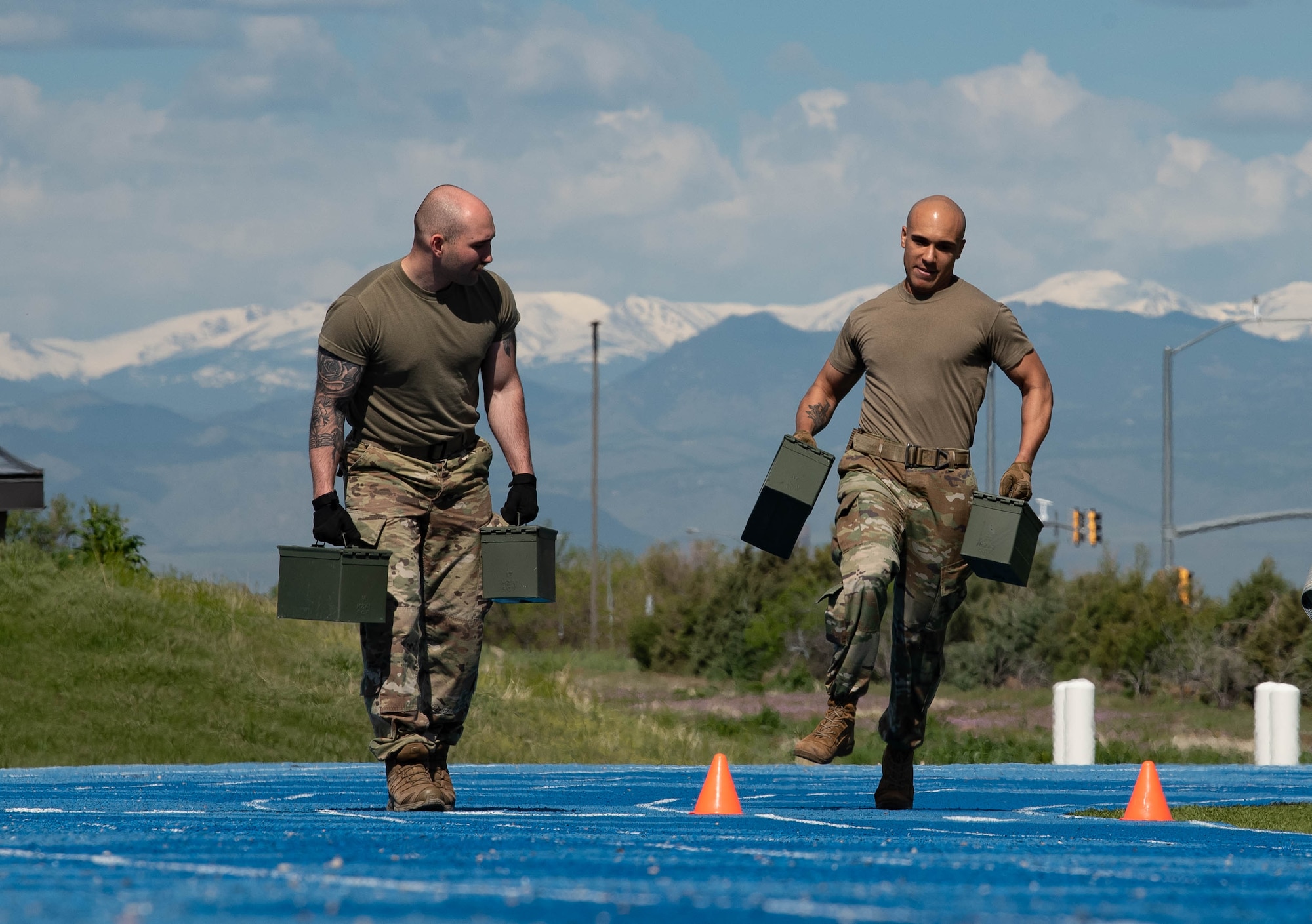 Two Men running with ammo cans