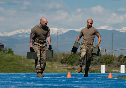  Two Men running with ammo cans