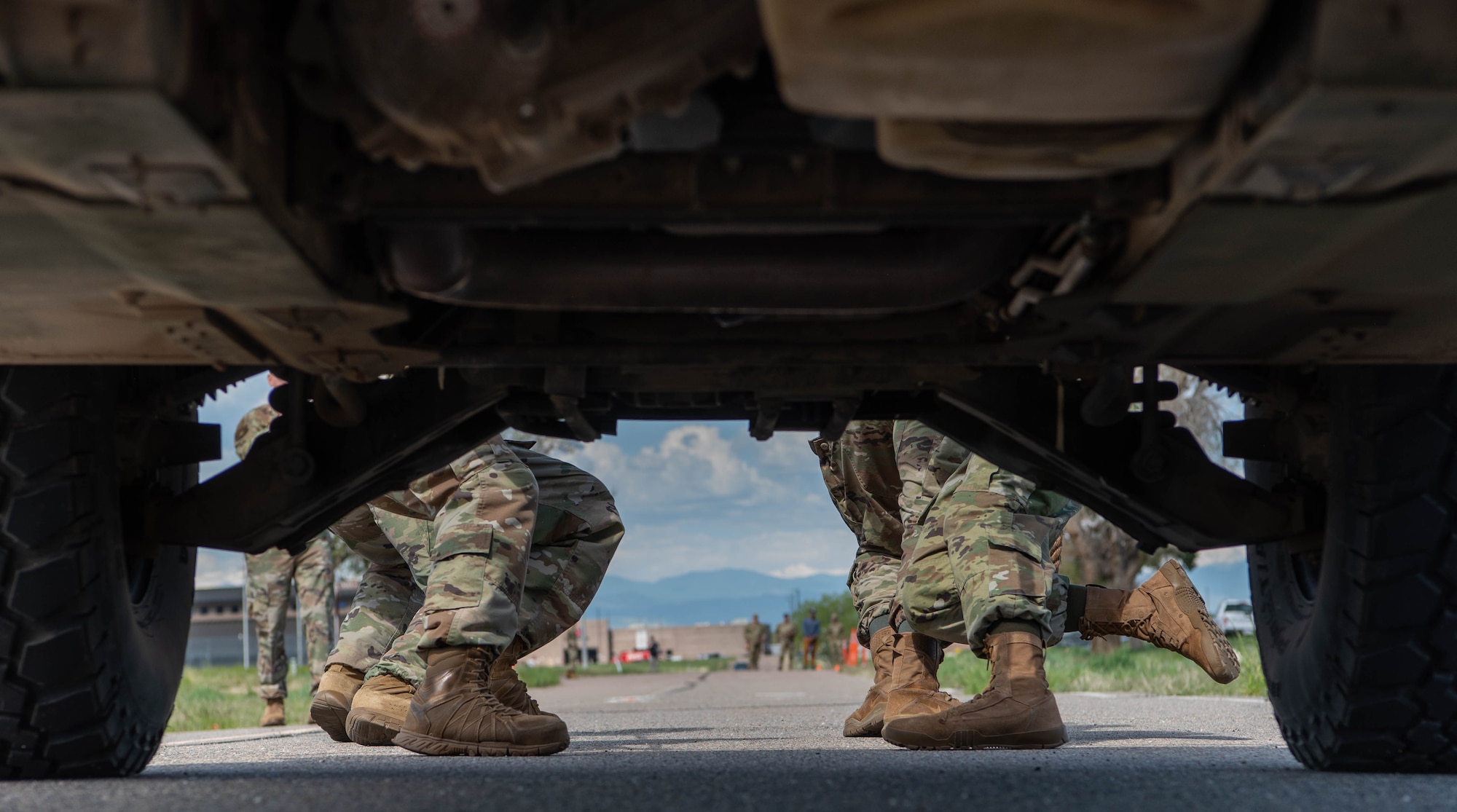 View under humvee being pulled by people