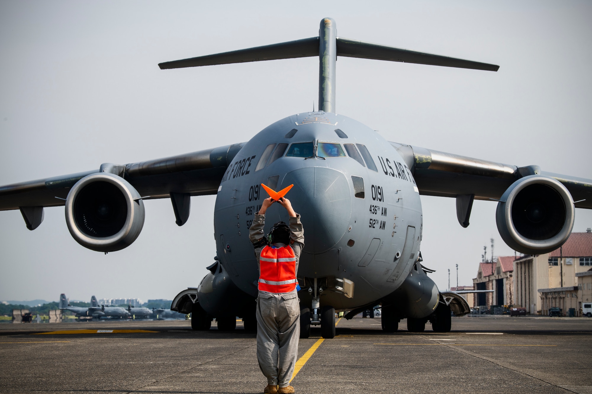 Senior Airman Elias Rivera Miguel, 730th Air Mobility Squadron C-17 crew chief, marshals a C-17 Globemaster III assigned to the 436th Airlift Wing, Dover Air Force Base, Del., May 10, 2023