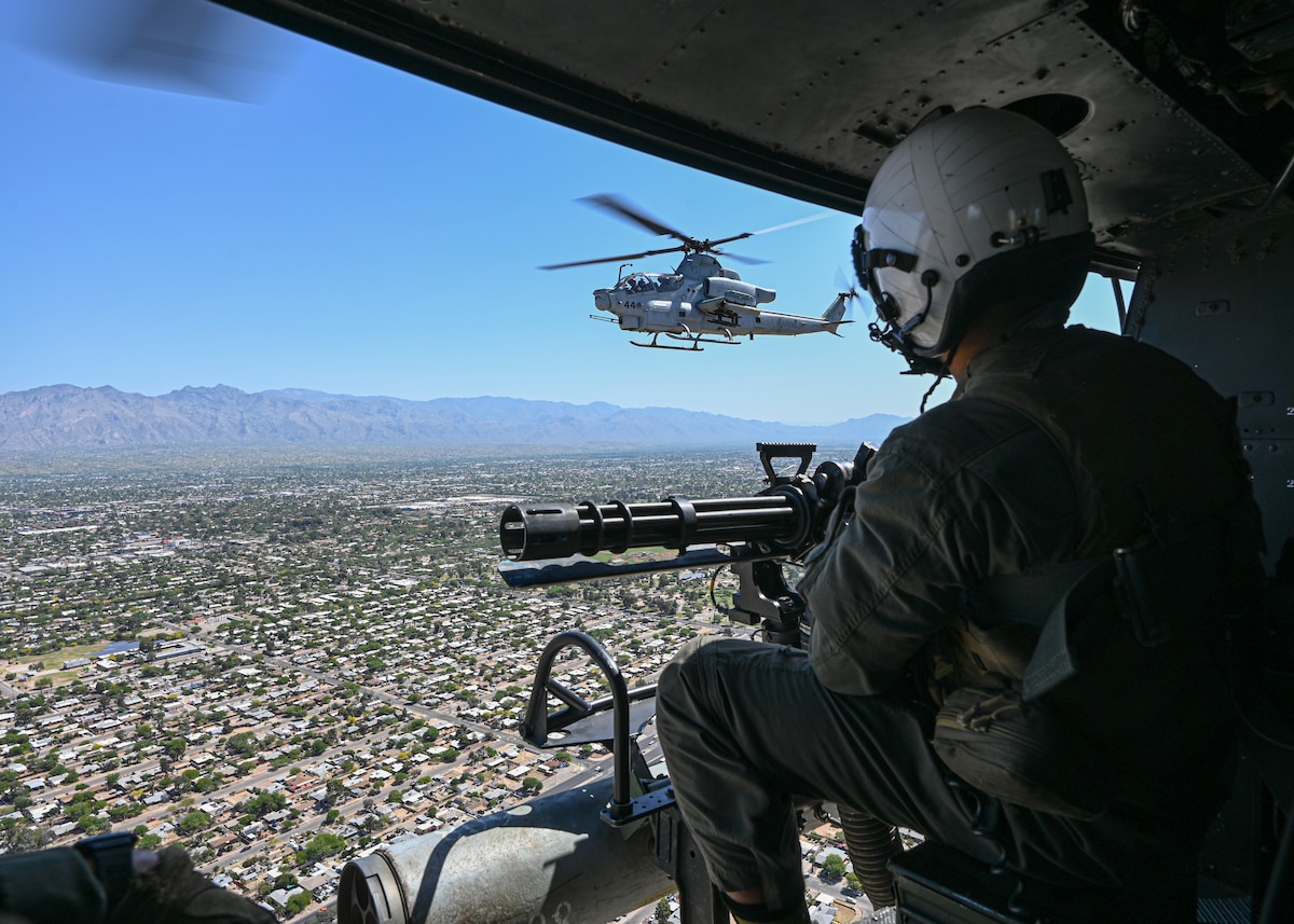 U.S. Marine Corps Lance Cpl. Rei Kitamura, Marine Light Attack Helicopter Squadron 775 crew chief, flies to his RED FLAG-Rescue 23-1 training exercise location across Arizona and New Mexico, May 13, 2023. Kitamura’s job includes being the helicopter’s maintainer, flyer, and machine gun operator. (U.S. Air Force photo by Staff Sgt. Abbey Rieves)