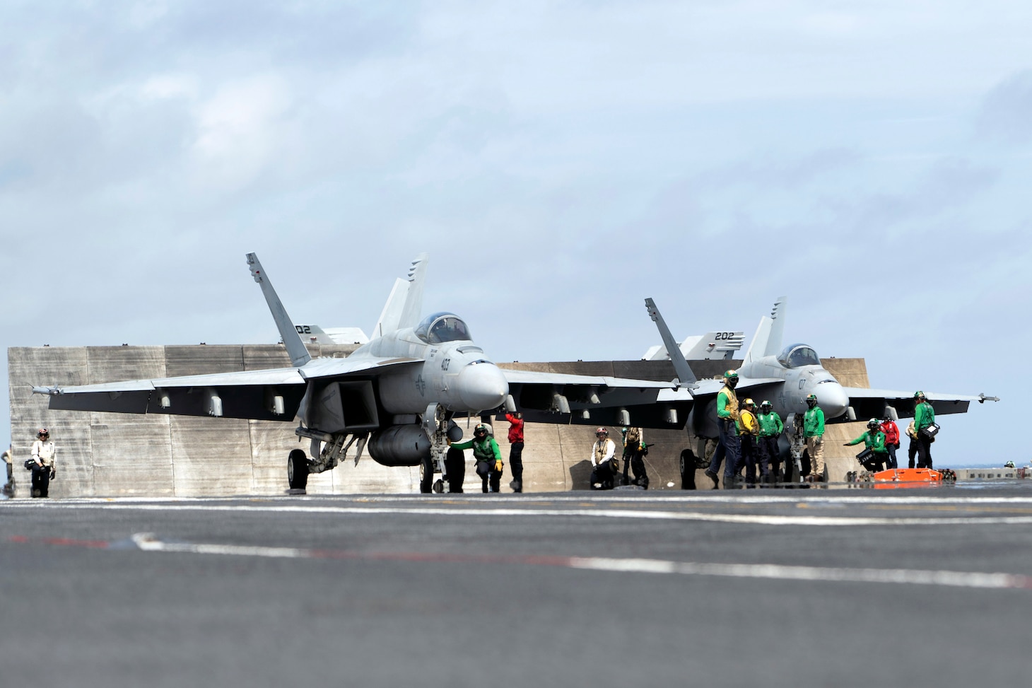 Sailors assigned to the first-in-class aircraft carrier USS Gerald R. Ford (CVN 78) and Carrier Air Wing (CVW) 8 prepare to launch two F/A-18E Super Hornets from the "Golden Warriors" of Strike Fighter Squadron (VFA) 87 and the "Ragin' Bulls" of VFA-37.