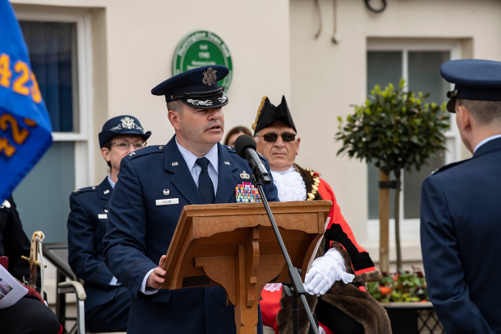 Col. Brian Filler, 501st Combat Support Wing commander, speaks in Huntingdon, England