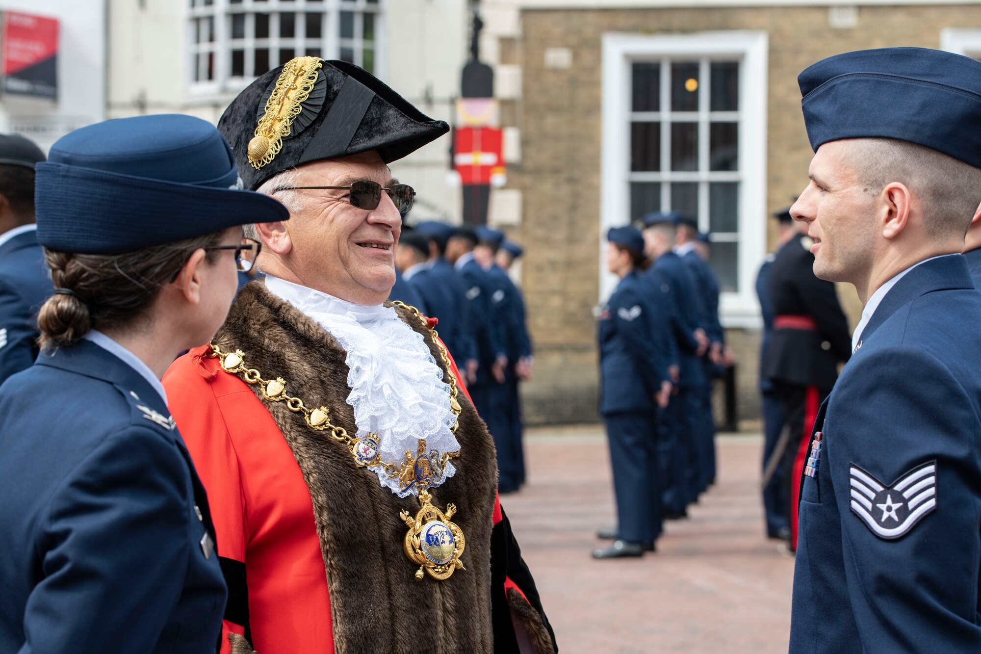 Councillor Philip Pearce, Mayor of Huntingdon, center left, talks with members of the 501st Combat Support Wing during a ceremony in Huntingdon, England