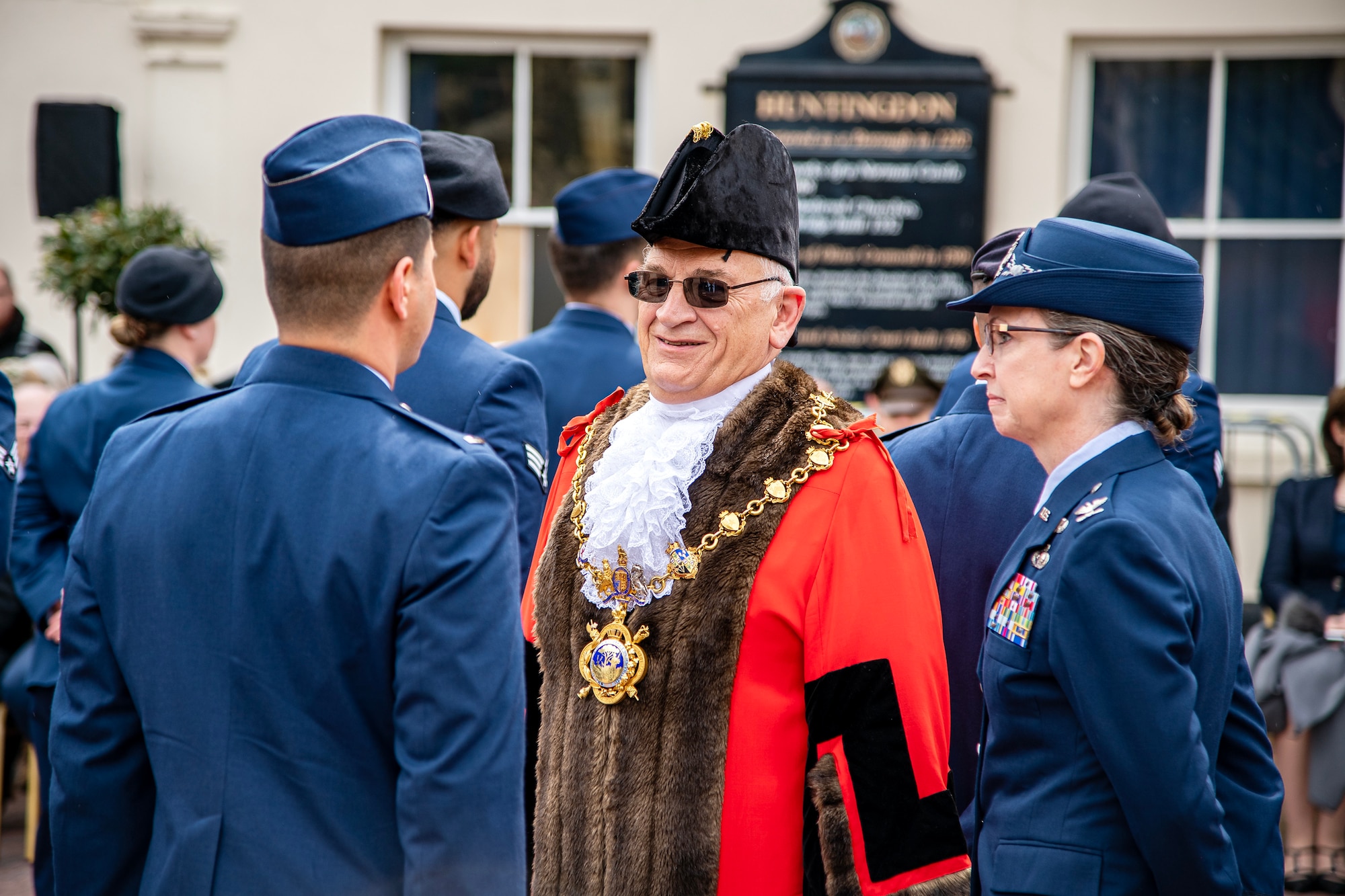 Councilor Phillip Pearce, center, Mayor of Huntindon, speaks with an Airman from 501st Combat Support Wing, in Huntingdon, England, May 19, 2023. In 2018 the 501st CSW was granted their freedom, an ancient tradition and high honor, by the city of Huntingdon and today Airmen exercised that freedom alongside local community members. (U.S. Air Force photo by Staff Sgt. Eugene Oliver)
