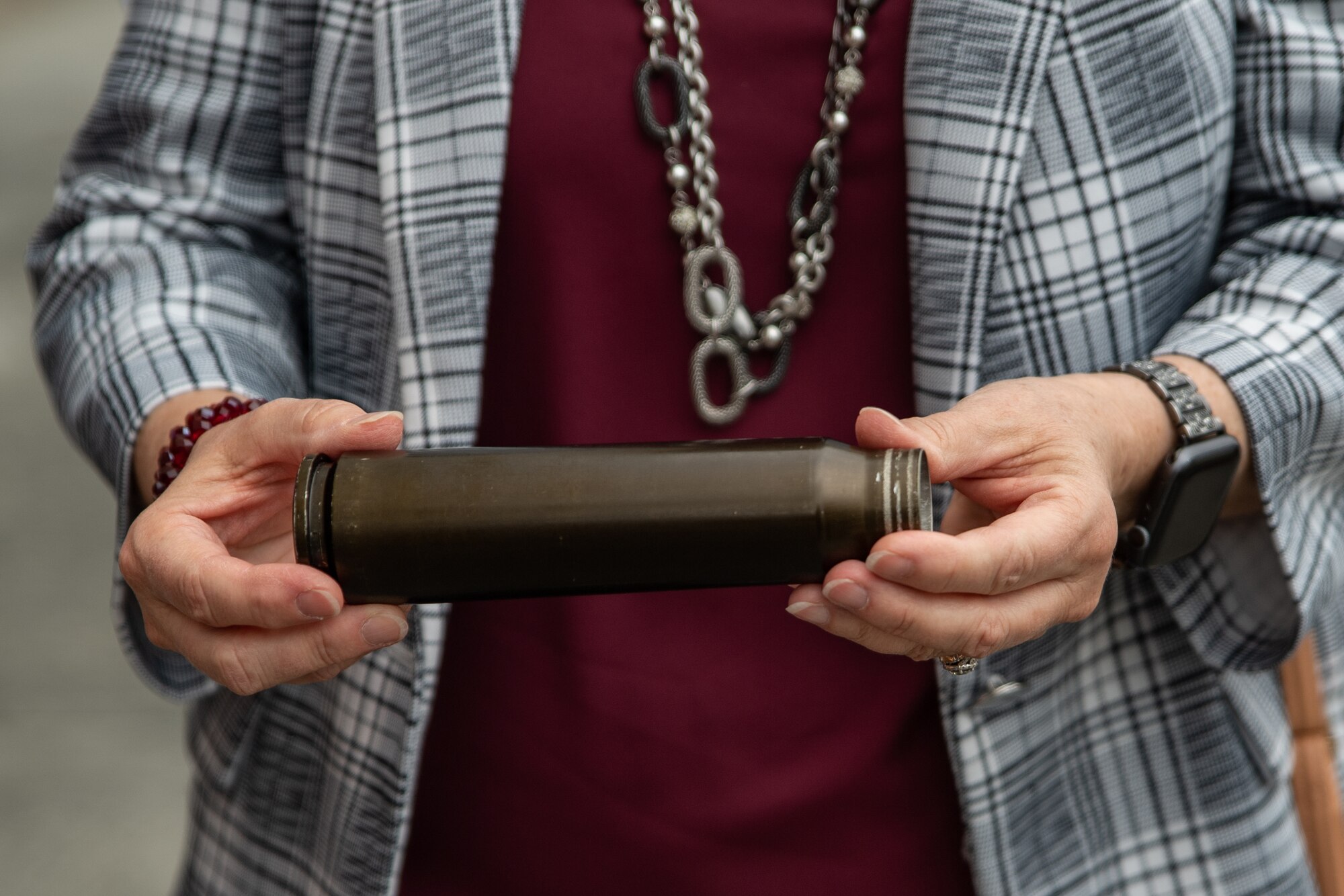 Person holds a round casing