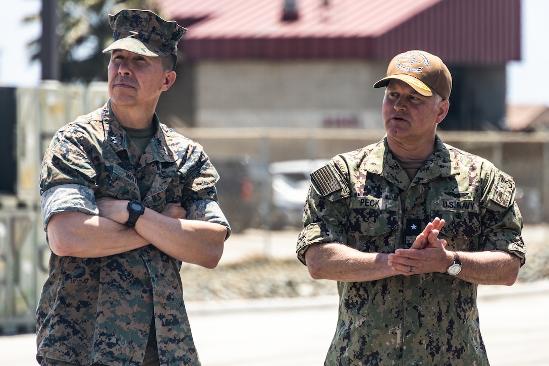 U.S. Navy Rear Adm. Randall W. Peck, right, the prospective commander of Expeditionary Strike Group 3, and U.S. Marine Corps Maj. Gen. Benjamin T. Watson, the commanding general of 1st Marine Division, visit 3rd Assault Amphibian Battalion, 1st MARDIV, at Marine Corps Base Camp Pendleton, California, May 9, 2023. The Marines and Sailors of ESG 3 and 1st MARDIV work together on a regular basis, and leaders from both commands met to further develop the Navy-Marine Corps relationship between the two units for future operations.