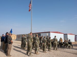 U.S. Air Force service members assigned to the 378th Air Expeditionary Wing stand in formation during a Police Week opening ceremony at Prince Sultan Air Base, Kingdom of Saudi Arabia, May 15, 2023. National Police Week pays special recognition to law enforcement officers who have lost their lives in the line of duty for the safety and protection of others. (U.S. Air Force photo by Senior Airman Stephani Barge)
