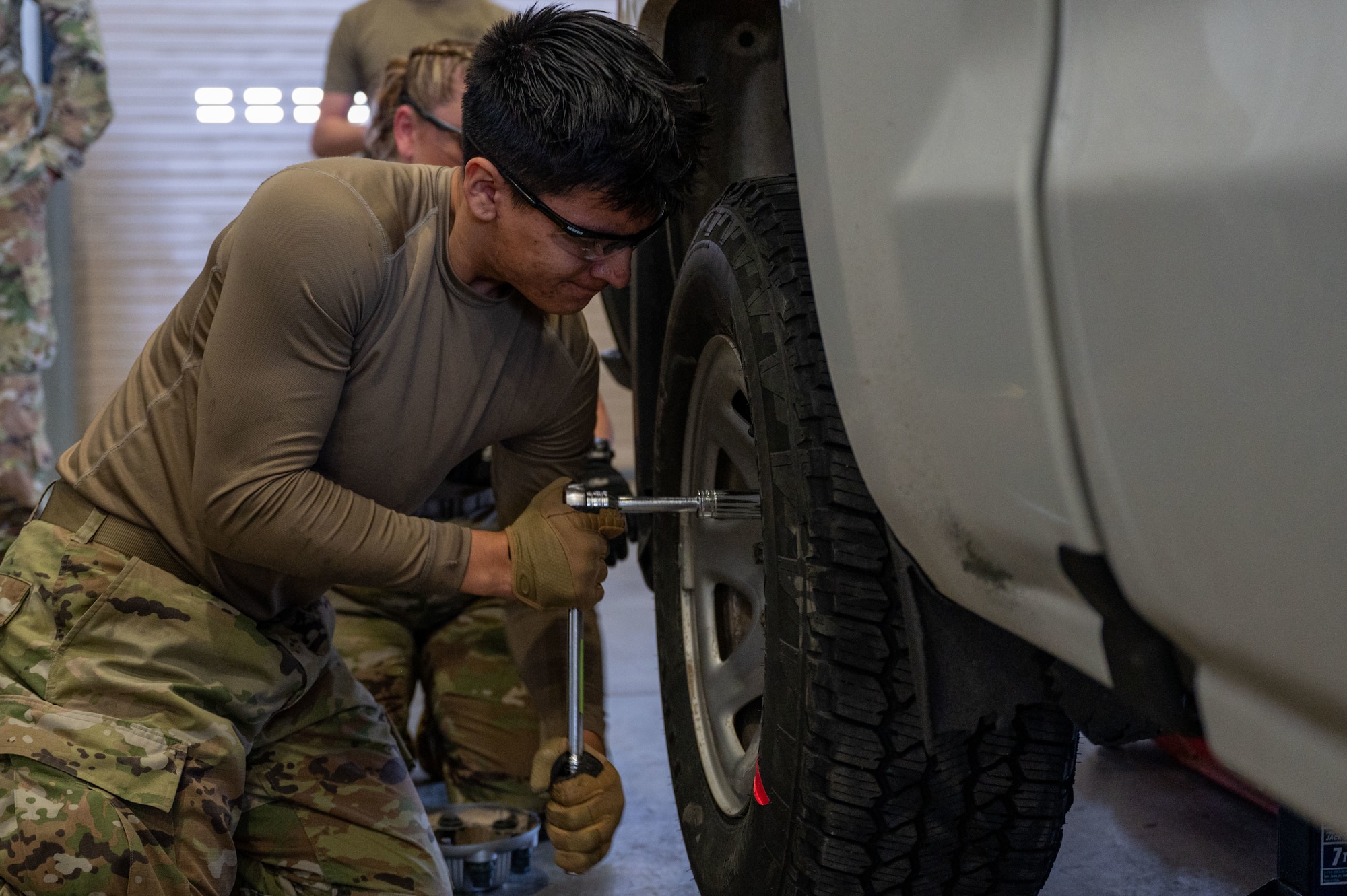 airman removing a tire