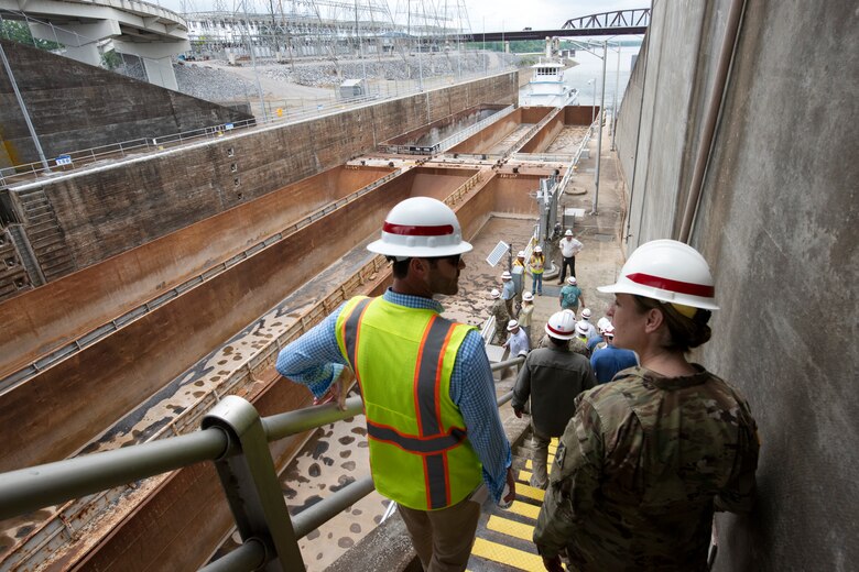 Brig. Gen. Kimberly Peeples (Far Right), U.S. Army Corps of Engineers Great Lakes and Ohio River Division commanding general, watches a towboat with empty barges approach Kentucky Lock on the Tennessee River in Grand Rivers, Kentucky, during the Ohio River Basin Inspection Tour May 16, 2023. The U.S. Army Corps of Engineers Nashville District operates and maintains the navigation lock at the Tennessee Valley Authority project. (USACE Photo by Lee Roberts)