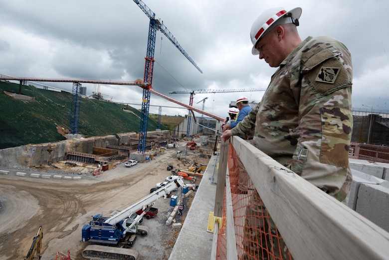 Col. Jayson Putnam, U.S. Army Corps of Engineers Huntington District commander, observes ongoing construction at the Kentucky Lock Addition Project on the Tennessee River in Grand Rivers, Kentucky, during the Ohio River Basin Inspection Tour May 16, 2023. (USACE Photo by Lee Roberts)