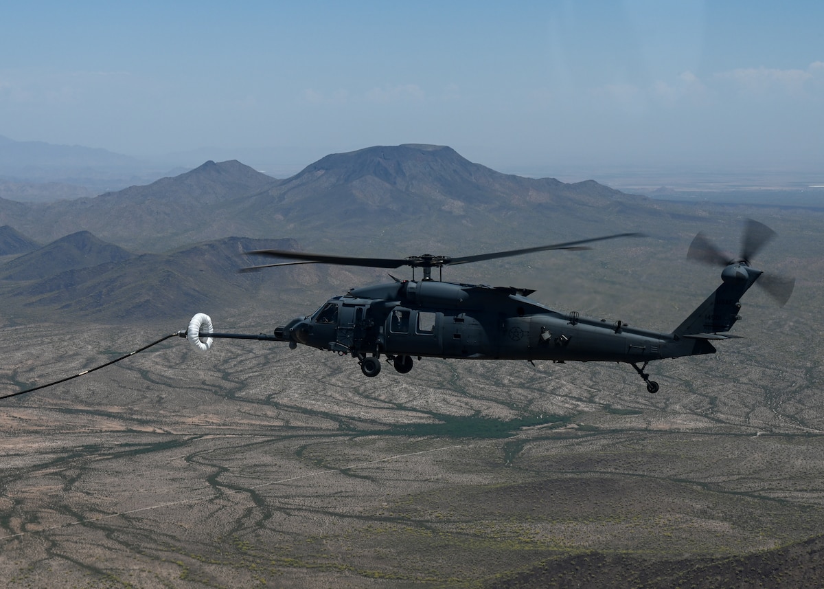 A helicopter is air-to-air refueled.