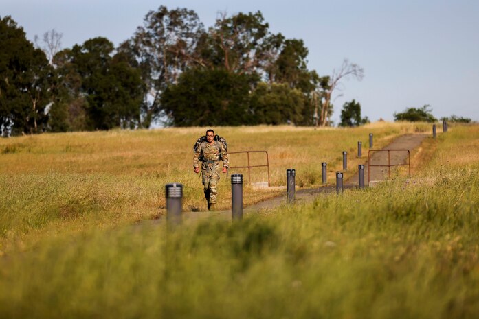 U.S. Air Force Senior Master Sgt. David Martinez, 9th Security Forces Squadron senior enlisted leader, jogs during the National Police Week 9K ruck march on May 15, 2023, at Beale Air Force Base, California.