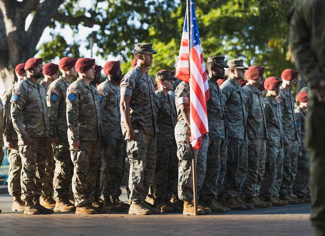 U.S. Marines with Combat Logistics Battalion 5, Combat Logistics Regiment 1, 1st Marine Logistics Group, and U.S. Army Soldiers with 11th Airborne Division stand in formation during the closing ceremony for Exercise Croix du Sud in Noumea, New Caledonia, May 6, 2023. Croix du Sud is the New Caledonian Armed Forces’ Combined Joint Task Force certification event with training objectives focused on a Humanitarian Assistance and Disaster Response, Non-combatant Evacuation Operations, and Stability and Support Operations scenario in Oceania with desired effects focused on enhancing military-military, civil-military, and joint/multinational coordination in the region during crisis response. Nearly 3,000 service members from 19 countries participated in the exercise, making it the largest multinational exercise ever conducted in the country. (U.S. Marine Corps photo by Staff Sgt. Dana Beesley)