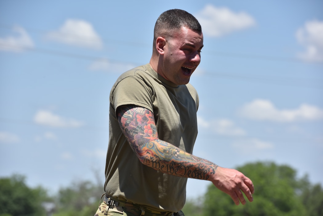 U.S. Air Force 1st Lt. Michael Fields, 17th Security Forces Squadron commander, is oleoresin capsicum sprayed during Police Week at Goodfellow Air Force Base, Texas, May 17, 2023. Fields had to run through a short course after being sprayed with a high-power mix made from peppers for a demonstration put on by the 17th Security Forces Squadron. (U.S. Air Force photo by Airman 1st Class Madison Collier)