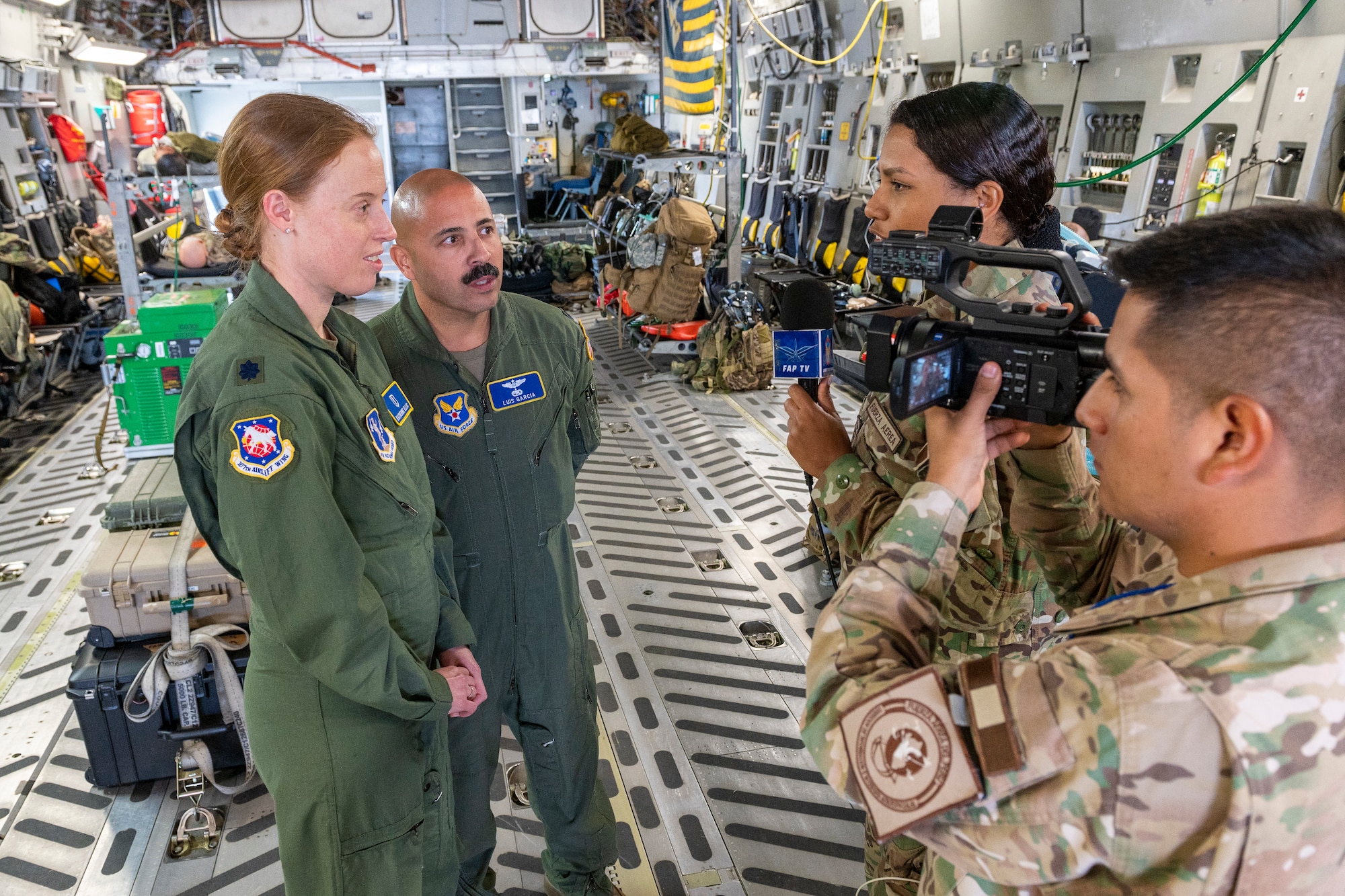 U.S. Air Force Lt. Col. Katherine Ellis, 167th Medical Group, is interviewed by Peruvian Air Force public affairs, as Lt. Col. Luis Garcia, 12 AF, provides translation, at Pisco Air Base, Peru, May 10, 2023, during exercise Cooperacion IX.
